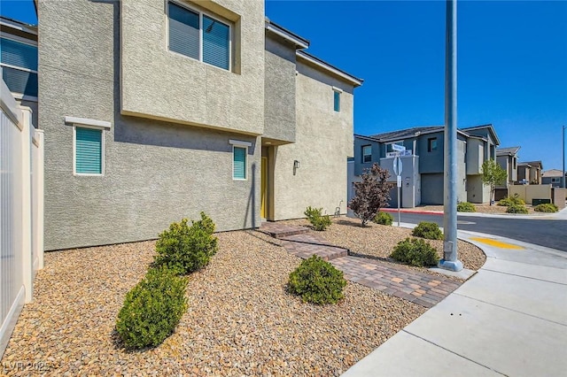2670 Mango Light Ave, North Las Vegas, NV 89086 - view of front facade with stucco siding and a residential view