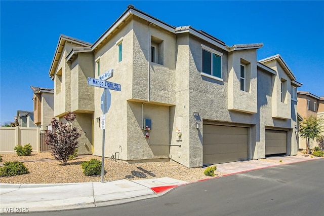 2670 Mango Light Ave, North Las Vegas, NV 89086 - view of front of home with a garage and stucco siding