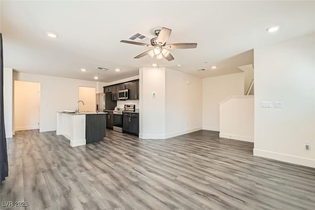 2670 Mango Light Ave, North Las Vegas, NV 89086 - unfurnished living room featuring recessed lighting, light wood-type flooring, and a ceiling fan