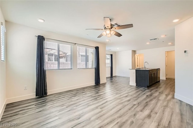 2670 Mango Light Ave, North Las Vegas, NV 89086 - unfurnished living room featuring light wood finished floors, recessed lighting, and ceiling fan