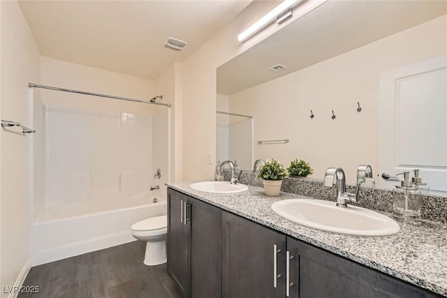 2670 Mango Light Ave, North Las Vegas, NV 89086 - full bath featuring double vanity, wood finished floors, and shower / tub combination