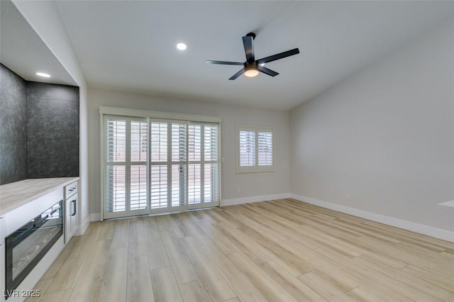 1844 Grand Prairie Ave, North Las Vegas, NV 89032 - unfurnished living room with light wood-type flooring, a ceiling fan, and recessed lighting