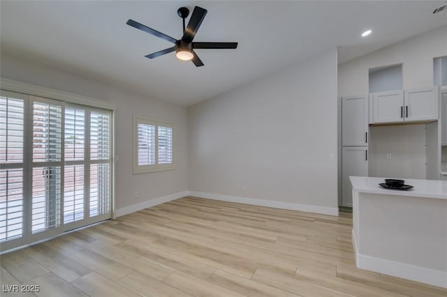 1844 Grand Prairie Ave, North Las Vegas, NV 89032 - unfurnished living room featuring lofted ceiling, ceiling fan, light wood-style floors, and recessed lighting