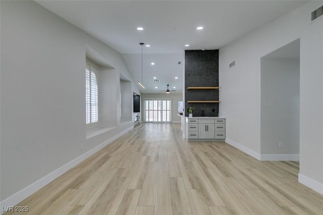 1844 Grand Prairie Ave, North Las Vegas, NV 89032 - unfurnished living room featuring light wood-style floors and recessed lighting