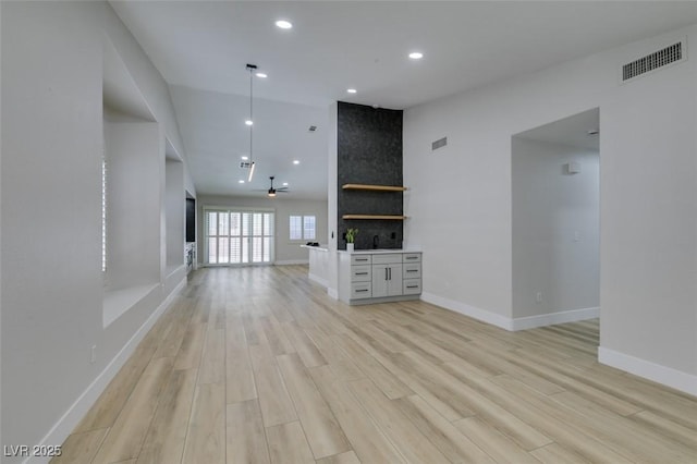 1844 Grand Prairie Ave, North Las Vegas, NV 89032 - unfurnished living room featuring light wood-style flooring, recessed lighting, and a high ceiling