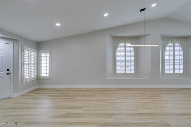 1844 Grand Prairie Ave, North Las Vegas, NV 89032 - empty room featuring light wood-style flooring, plenty of natural light, recessed lighting, and lofted ceiling