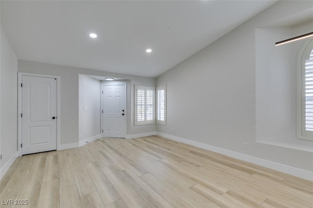1844 Grand Prairie Ave, North Las Vegas, NV 89032 - foyer featuring light wood-type flooring, lofted ceiling, and recessed lighting