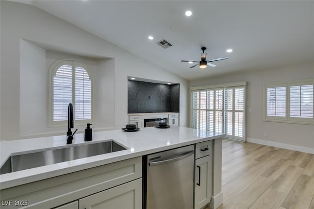 1844 Grand Prairie Ave, North Las Vegas, NV 89032 - kitchen with dishwasher, vaulted ceiling, ceiling fan, light wood-style floors, and recessed lighting