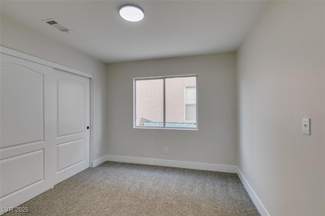 1844 Grand Prairie Ave, North Las Vegas, NV 89032 - unfurnished bedroom featuring light colored carpet and a closet