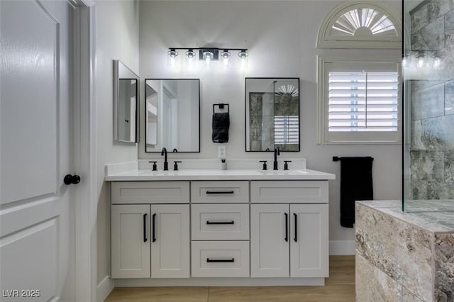 1844 Grand Prairie Ave, North Las Vegas, NV 89032 - full bathroom featuring double vanity, wood finished floors, and a shower