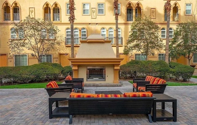 2455 W Serene Ave Unit 620, Las Vegas, NV 89123 - view of patio with an outdoor living space with a fireplace