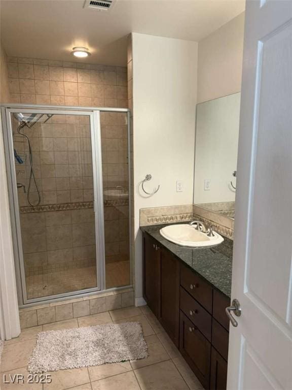 2455 W Serene Ave Unit 620, Las Vegas, NV 89123 - bathroom with vanity, tile patterned floors, and a stall shower