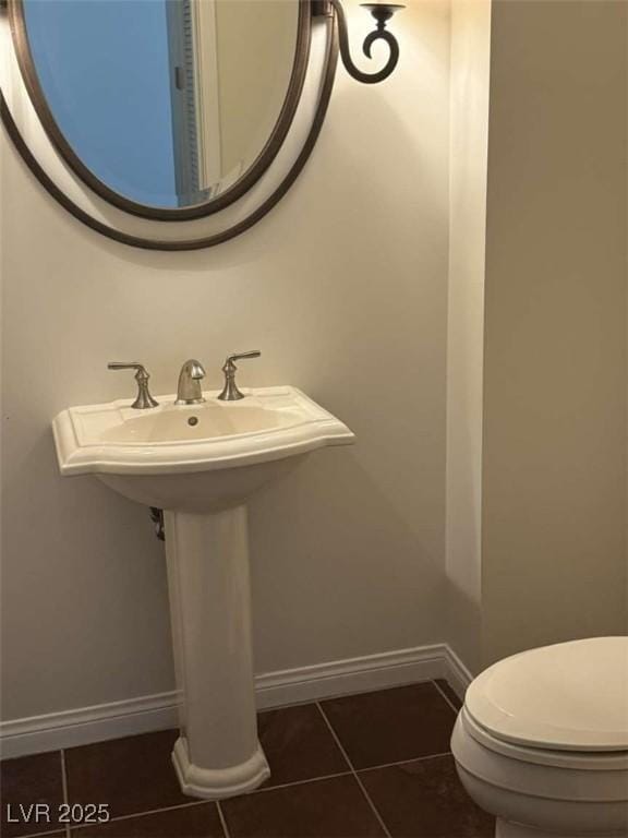 2455 W Serene Ave Unit 620, Las Vegas, NV 89123 - half bath featuring tile patterned flooring and toilet