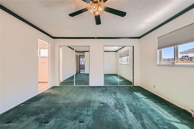7704 Peacock Ave, Las Vegas, NV 89145 - unfurnished bedroom with multiple closets, carpet floors, a textured ceiling, crown molding, and ceiling fan