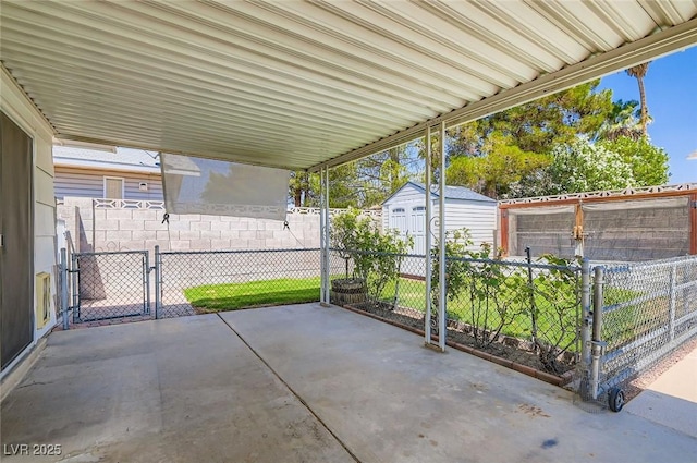7704 Peacock Ave, Las Vegas, NV 89145 - view of patio / terrace with a storage shed and a gate