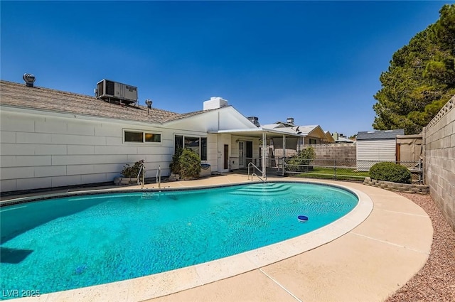 7704 Peacock Ave, Las Vegas, NV 89145 - view of pool with a shed and a patio area