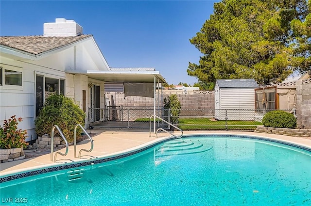 7704 Peacock Ave, Las Vegas, NV 89145 - view of swimming pool featuring a patio area and a storage shed