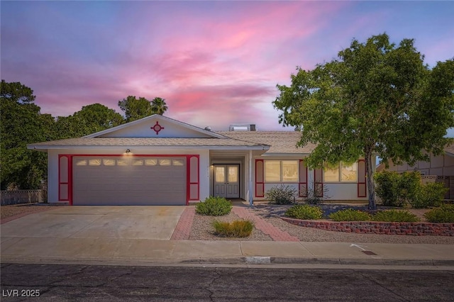 7704 Peacock Ave, Las Vegas, NV 89145 - ranch-style house featuring driveway, an attached garage, and stucco siding