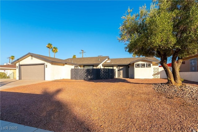 1571 Pawnee Dr, Las Vegas, NV 89169 - ranch-style home with stucco siding, an attached garage, and concrete driveway