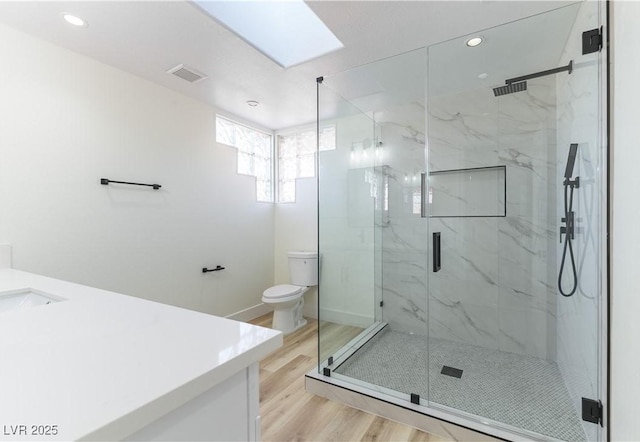 1571 Pawnee Dr, Las Vegas, NV 89169 - full bathroom with vanity, wood finished floors, a marble finish shower, and recessed lighting