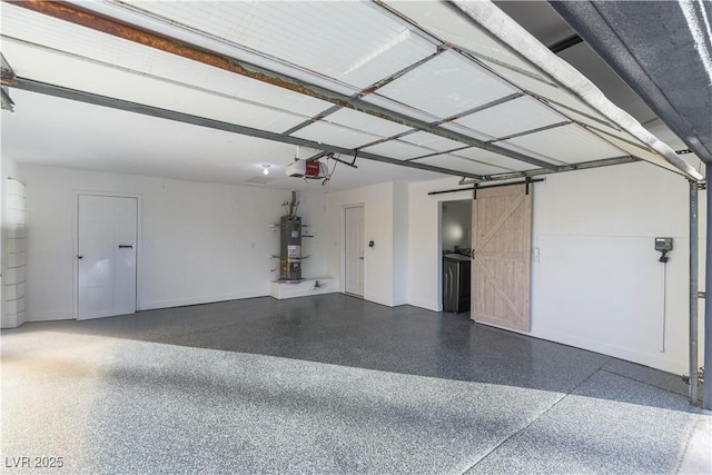 1571 Pawnee Dr, Las Vegas, NV 89169 - garage with water heater and a garage door opener
