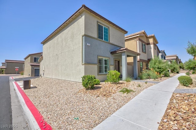 7212 Sunray Point St, North Las Vegas, NV 89084 - view of side of home with stucco siding