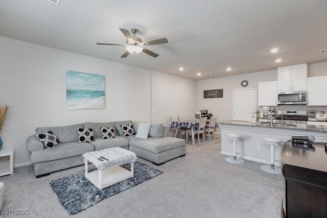 7212 Sunray Point St, North Las Vegas, NV 89084 - carpeted living room featuring ceiling fan and recessed lighting