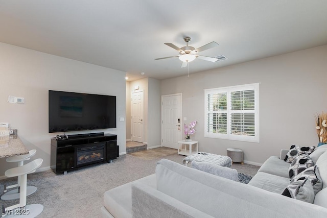 7212 Sunray Point St, North Las Vegas, NV 89084 - living area featuring a ceiling fan and light carpet