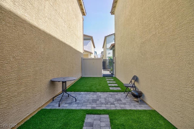 7212 Sunray Point St, North Las Vegas, NV 89084 - view of yard with a gate and a patio