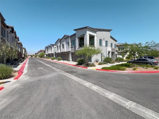 7226 N Decatur Blvd Unit 4, Las Vegas, NV 89131 - view of asphalt road with a residential view and curbs
