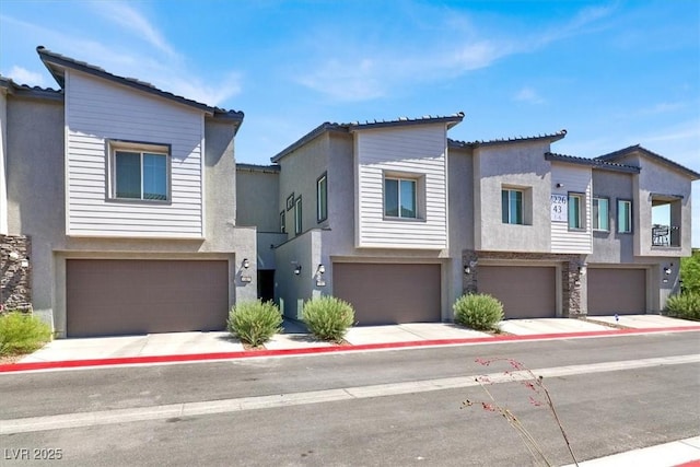 7226 N Decatur Blvd Unit 4, Las Vegas, NV 89131 - modern home featuring stucco siding and an attached garage