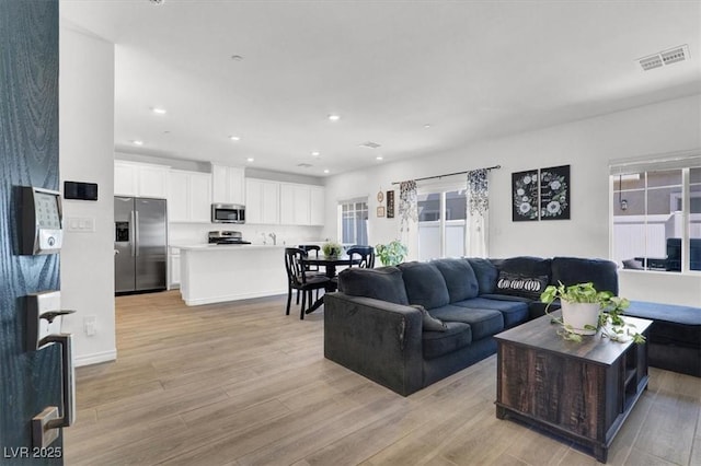 7226 N Decatur Blvd Unit 4, Las Vegas, NV 89131 - living area featuring light wood-type flooring and recessed lighting