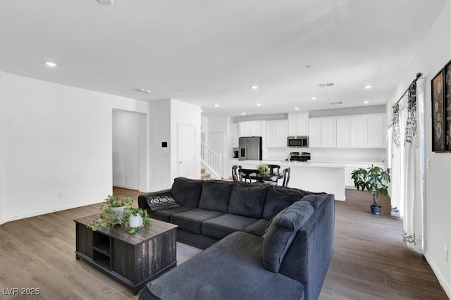 7226 N Decatur Blvd Unit 4, Las Vegas, NV 89131 - living room with stairs, wood finished floors, and recessed lighting