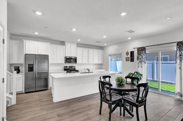 7226 N Decatur Blvd Unit 4, Las Vegas, NV 89131 - dining space featuring light wood finished floors and recessed lighting