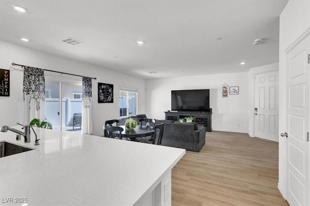 7226 N Decatur Blvd Unit 4, Las Vegas, NV 89131 - kitchen with recessed lighting and light wood-style flooring