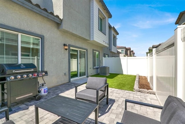 7226 N Decatur Blvd Unit 4, Las Vegas, NV 89131 - fenced backyard with a patio and a grill