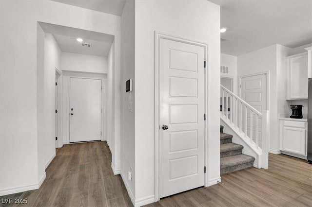 7226 N Decatur Blvd Unit 4, Las Vegas, NV 89131 - hallway featuring stairway and wood finished floors