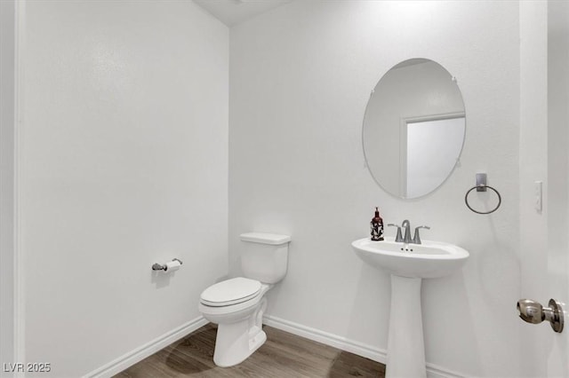 7226 N Decatur Blvd Unit 4, Las Vegas, NV 89131 - bathroom featuring toilet and wood finished floors
