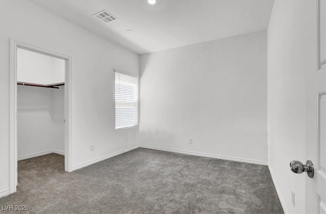 7226 N Decatur Blvd Unit 4, Las Vegas, NV 89131 - unfurnished bedroom featuring carpet flooring and a spacious closet