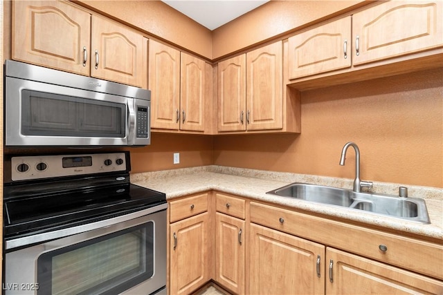 1948 Las Palmas Ln Unit 277, Laughlin, NV 89029 - kitchen featuring stainless steel appliances, light brown cabinetry, and light countertops