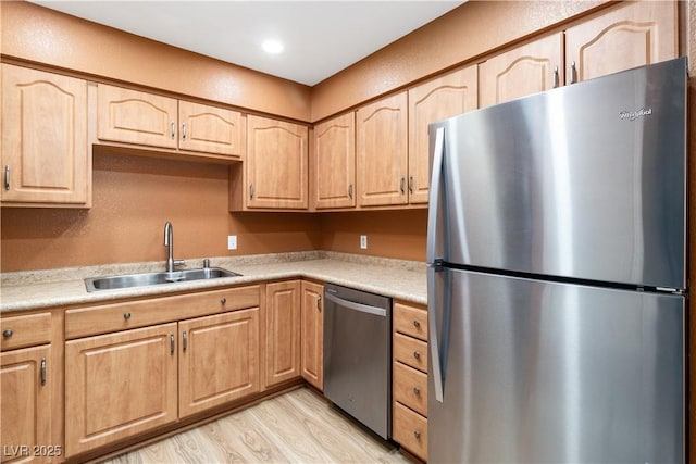 1948 Las Palmas Ln Unit 277, Laughlin, NV 89029 - kitchen featuring appliances with stainless steel finishes, light brown cabinets, light wood-type flooring, light countertops, and recessed lighting