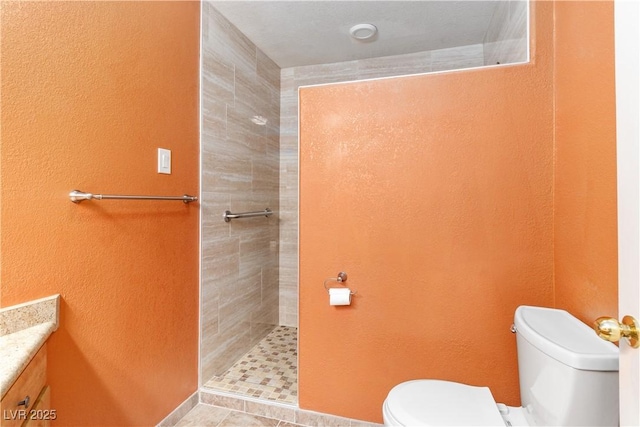 1948 Las Palmas Ln Unit 277, Laughlin, NV 89029 - bathroom with a tile shower, vanity, and a textured wall