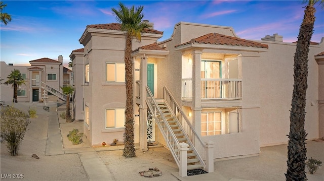 1948 Las Palmas Ln Unit 277, Laughlin, NV 89029 - view of front of home with stairway, stucco siding, and a tiled roof
