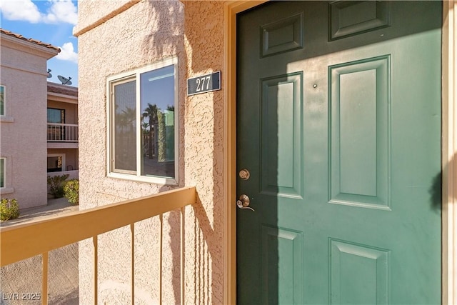 1948 Las Palmas Ln Unit 277, Laughlin, NV 89029 - doorway to property featuring stucco siding and a balcony