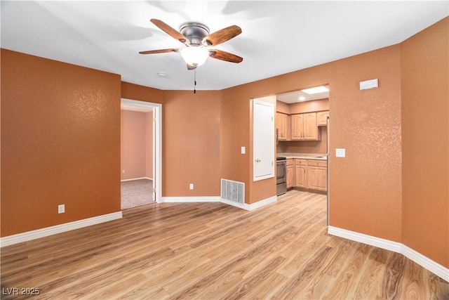 1948 Las Palmas Ln Unit 277, Laughlin, NV 89029 - unfurnished living room with light wood finished floors and ceiling fan