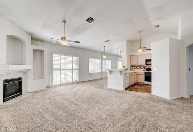 6201 E Lake Mead Blvd Unit 223, Las Vegas, NV 89156 - unfurnished living room with a ceiling fan, light colored carpet, a tile fireplace, and lofted ceiling