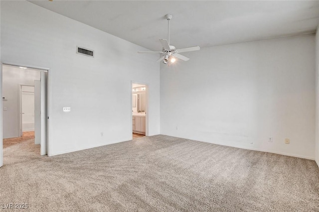 6201 E Lake Mead Blvd Unit 223, Las Vegas, NV 89156 - empty room with high vaulted ceiling, light colored carpet, and a ceiling fan