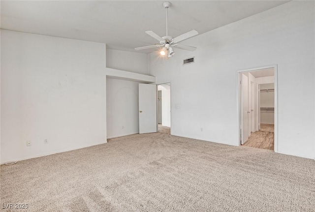 6201 E Lake Mead Blvd Unit 223, Las Vegas, NV 89156 - unfurnished bedroom with light carpet, high vaulted ceiling, and a ceiling fan