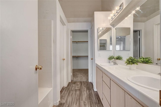6201 E Lake Mead Blvd Unit 223, Las Vegas, NV 89156 - full bath featuring double vanity, wood finished floors, and a spacious closet