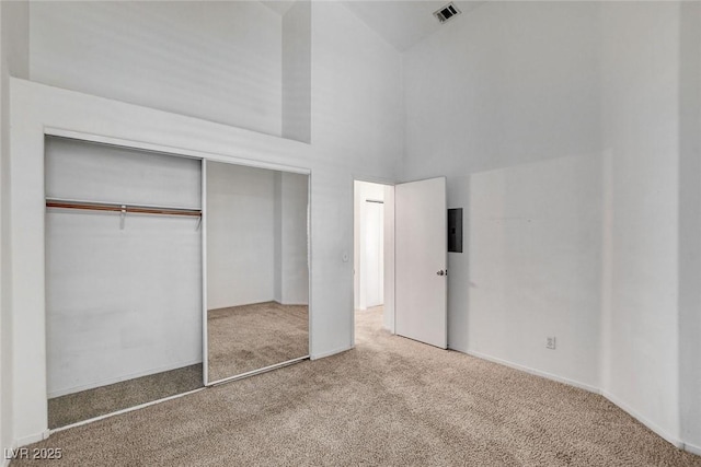 6201 E Lake Mead Blvd Unit 223, Las Vegas, NV 89156 - unfurnished bedroom with carpet, high vaulted ceiling, and a closet
